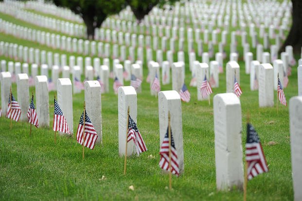 Tomb stones with flags at Arlington national cemetary.